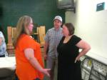 Kelly explains it to Michael and DeAnna